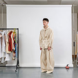 Gravity Field Jacket in natural seeded cotton canvas, worn cinched at the waist in three-quarter view