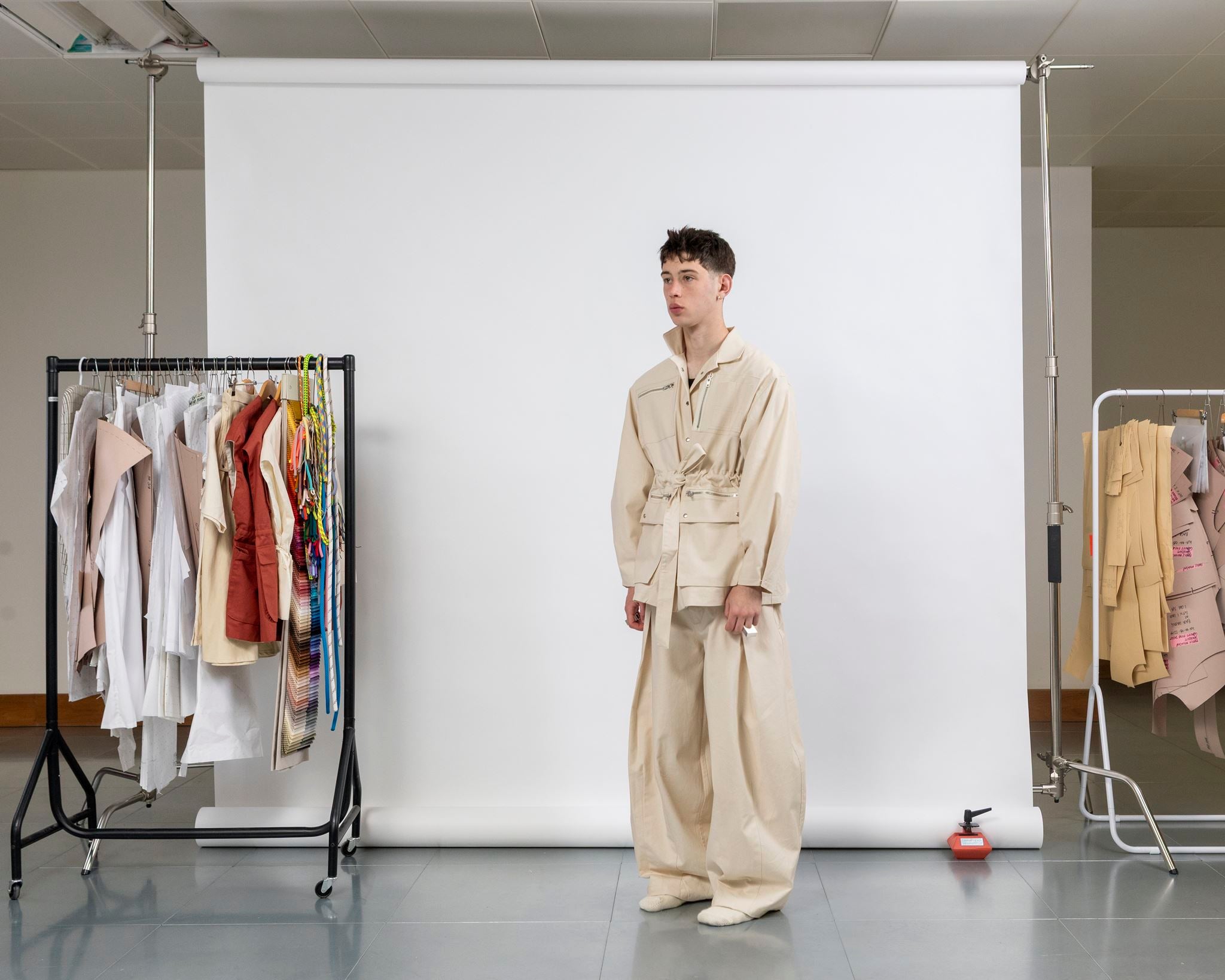 Gravity Field Jacket in natural seeded cotton canvas, worn cinched at the waist in three-quarter view