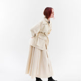 Gravity Field Jacket in natural seeded cotton canvas, worn cinched at the waist.