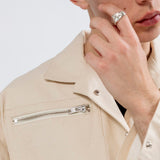 Gravity Field Jacket in natural seeded cotton canvas, showing stainless steel zip pocket and press studs